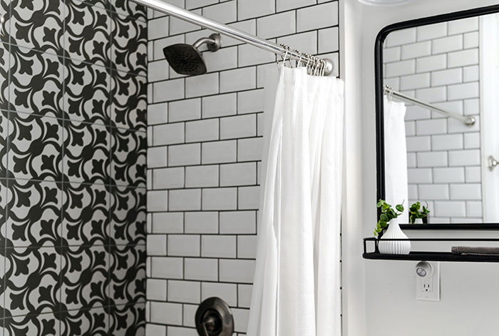 White shower curtain in a bright bathroom White shower curtain in a bright bathroom