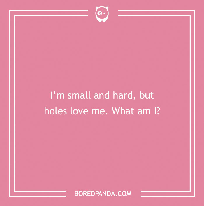 Pink background with text riddle: "I'm small and hard, but holes love me. What am I?" from Bored Panda, related to dirty riddles.