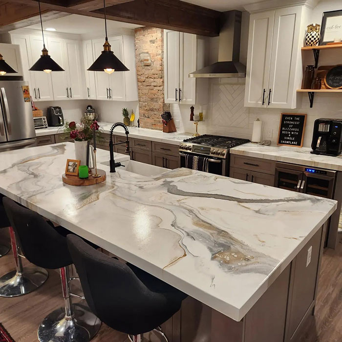 White epoxy countertop with modern kitchen setup, showcasing smooth finish and elegant marbling in a functional space