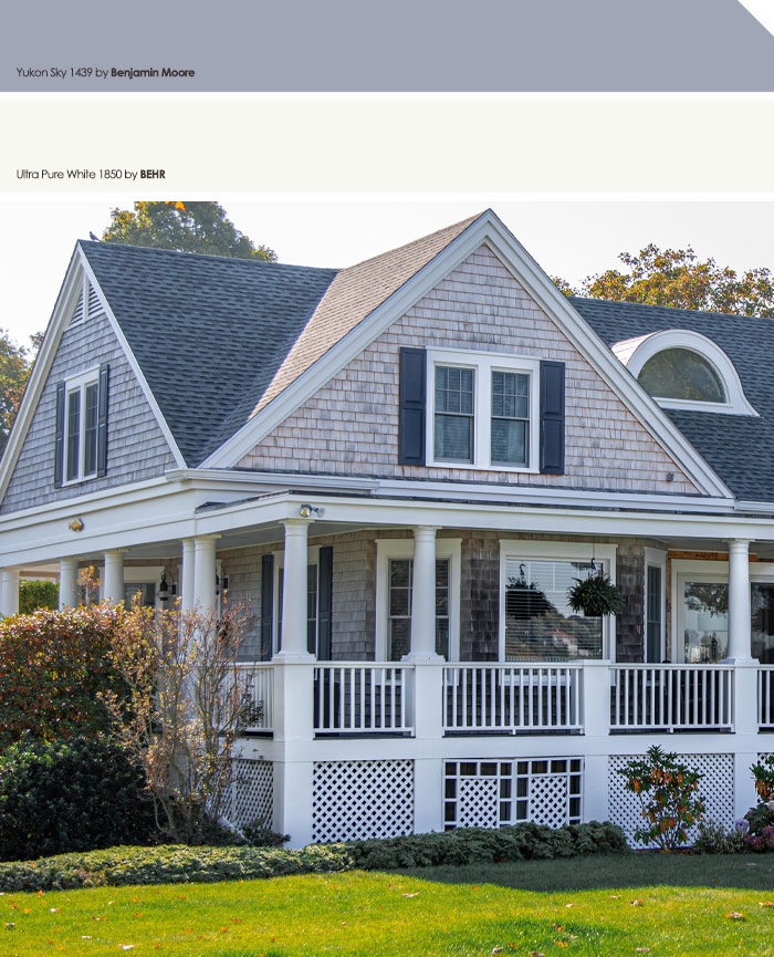 Gray wooden house with white trim and porch showcasing popular exterior house colors to turn heads in the neighborhood