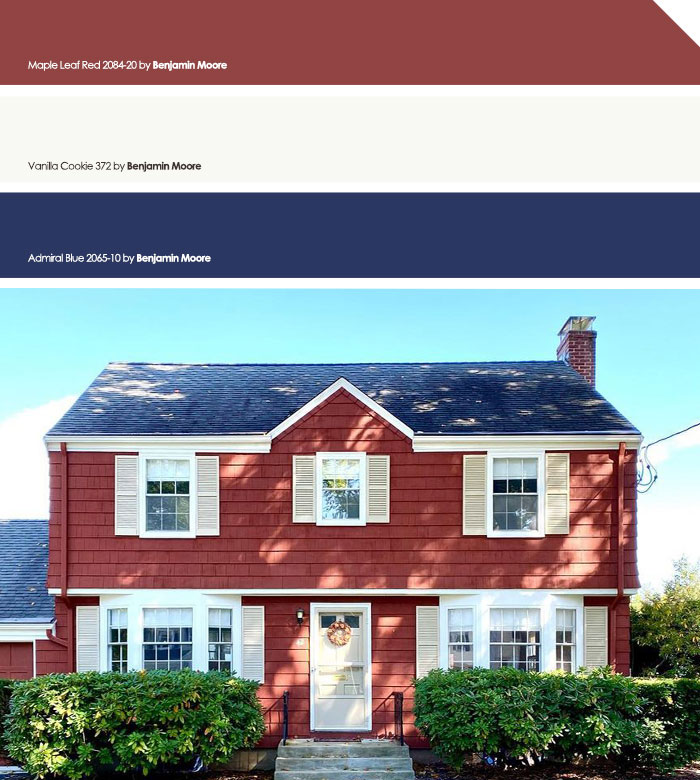 Red painted house with white trim and green bushes, showcasing exterior house colors to turn heads in the neighborhood.