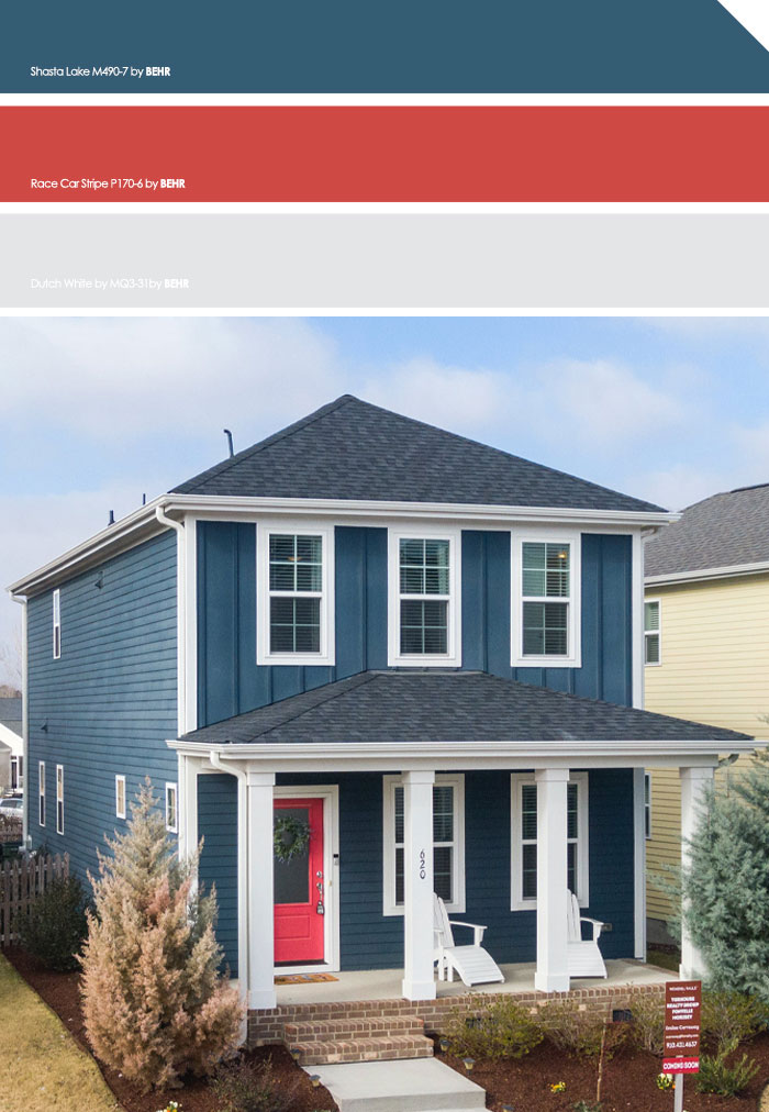 Blue exterior house with red doors and white trim featuring modern curb appeal in neighborhood exterior house colors.