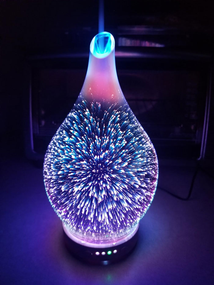 Glass essential oil diffuser with colorful 3D light effects, a unique gift idea for the partner who’s seen it all.