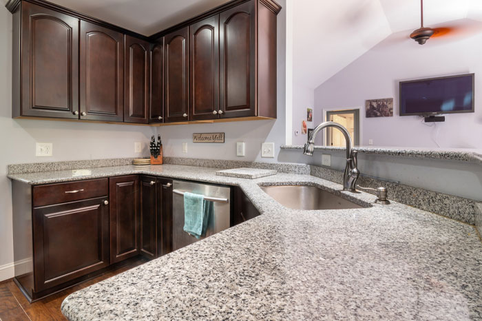 A honed grey granite countertop in the kitchen. A honed grey granite countertop in the kitchen.