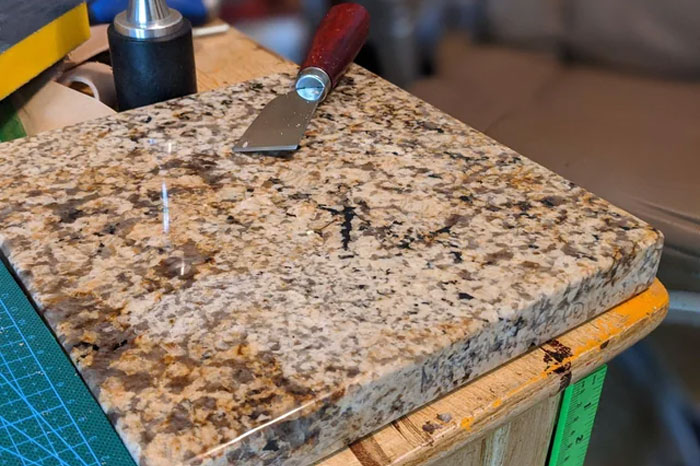 A thick brown granite countertop. A thick brown granite countertop.