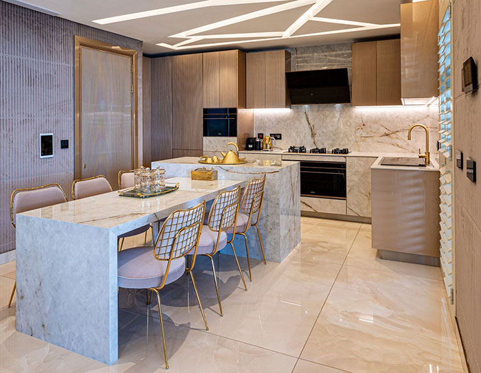 Bright modern kitchen with gold parts