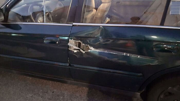 First My Car Gets Rear-Ended On New Year's Day. Now Godzilla Decided To Rip A Hole In My Door