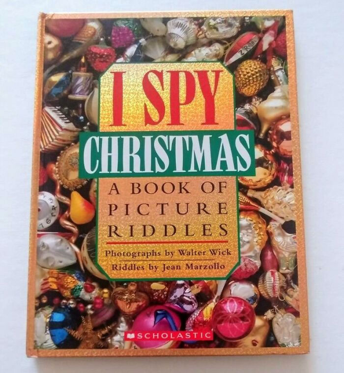 Continuously Looking At The Beautiful Pictures In The I Spy Christmas Book