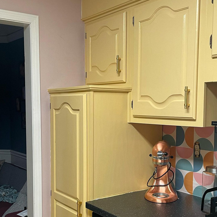 Yellow-painted kitchen cabinets&nbsp;