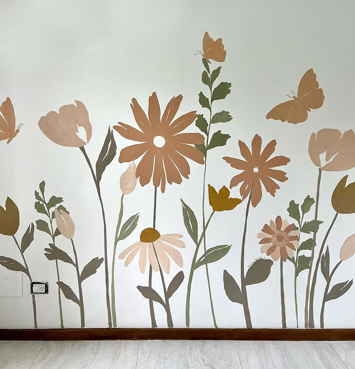 Floral wall painting design with earthy tones and butterflies, creating a calming and artistic wall painting inspiration.