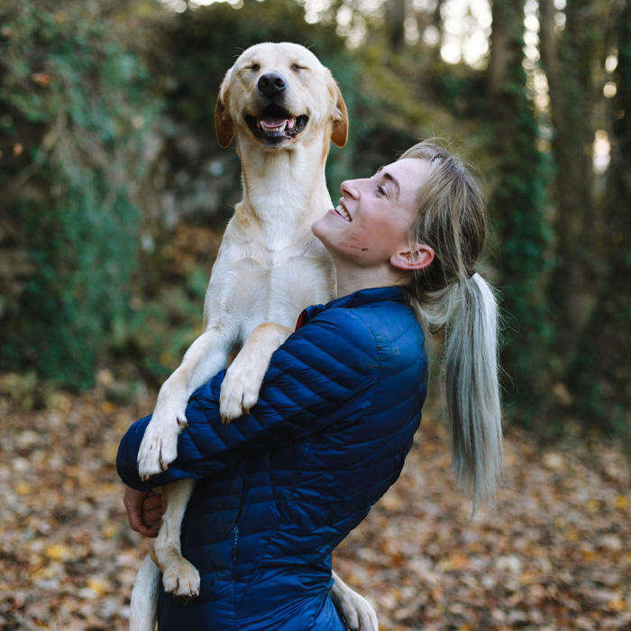 Woman holding a dog Woman holding a dog