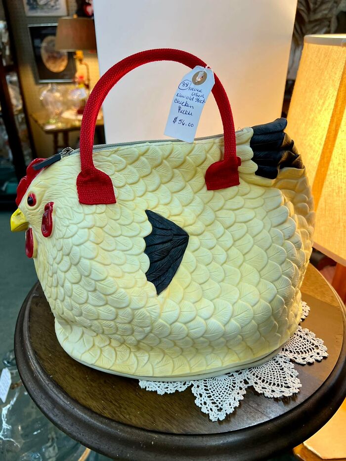 Unique chicken-shaped purse found at thrift stores with detailed feathers and a bright red handle for sale.