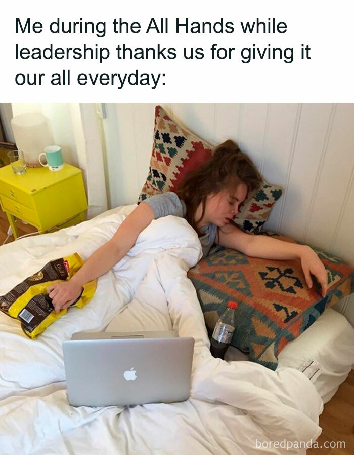 Person napping with laptop on bed, surrounded by snacks, illustrating a funny work meme.