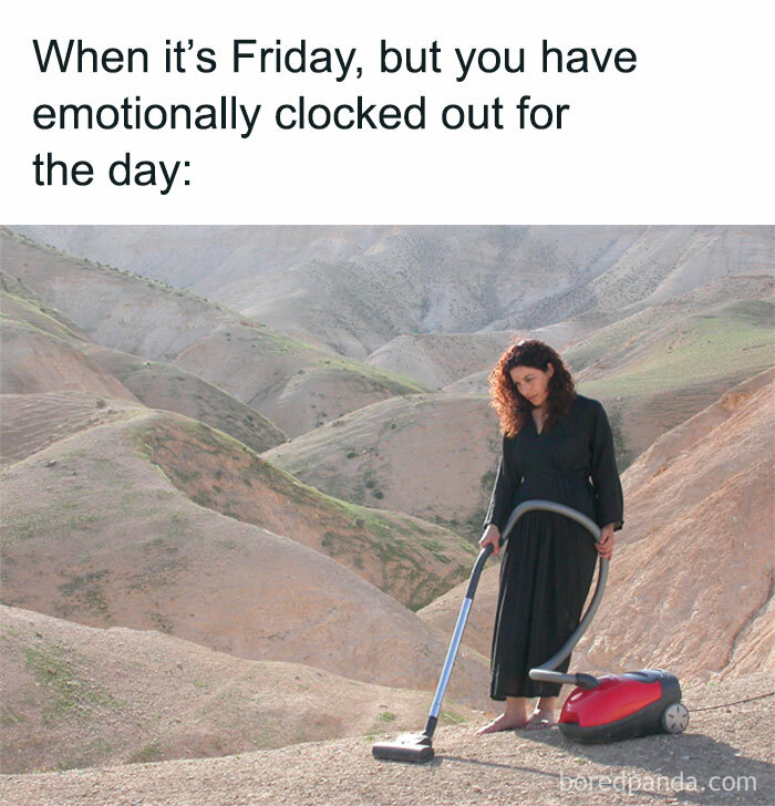 Woman with vacuum in desert, illustrating funny work memes about emotionally checking out on Fridays.