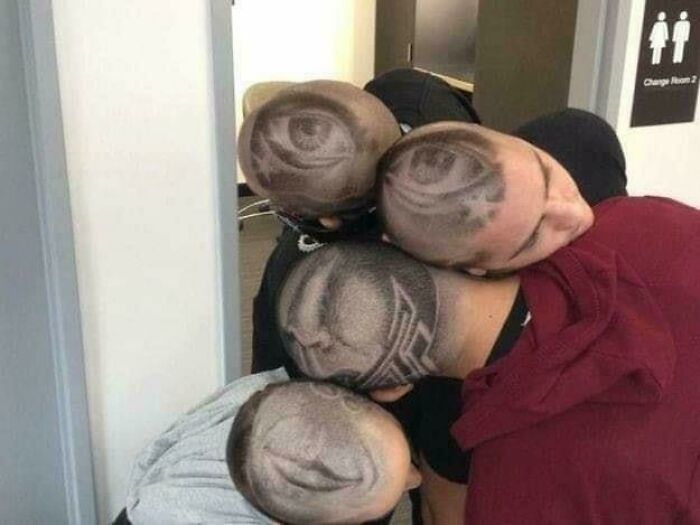 Five people with creative shaved head designs forming an eye pattern, creating an unexpected and hilarious image.