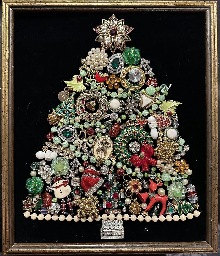 Unique thrift store find of a Christmas tree made from various vintage brooches and costume jewelry in a shadow box frame.