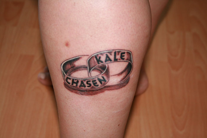 Tattoo on a leg with interlocking rings featuring names, central to family drama involving removal demand by fianc&eacute;.