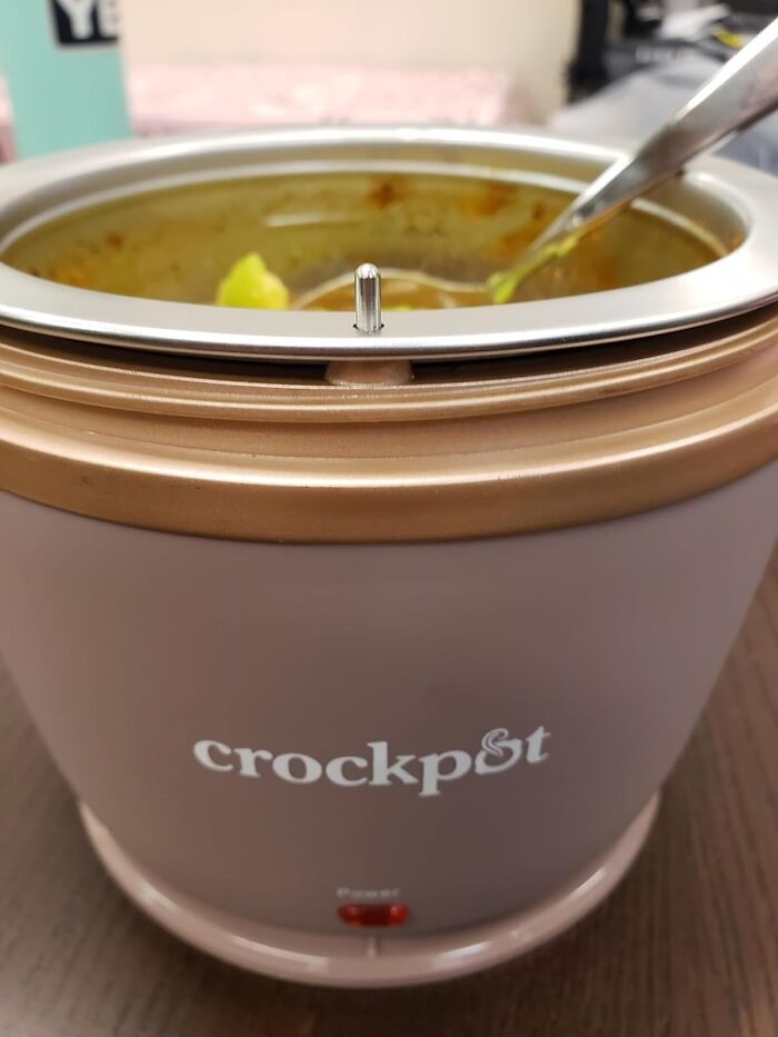 Small crockpot with soup inside and a spoon, demonstrating practical life hacks for easy meal preparation.