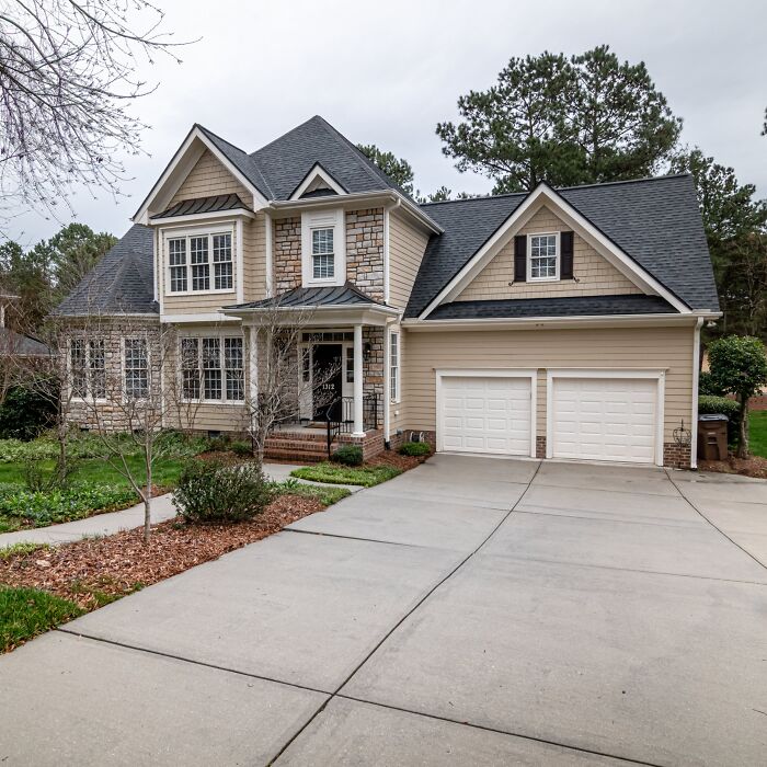 House with parallel walkway and driveway