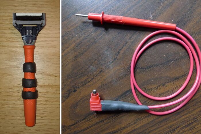 Razor handle with grip enhancements and a red electrical test probe on wooden surfaces, showcasing problem-solving products.