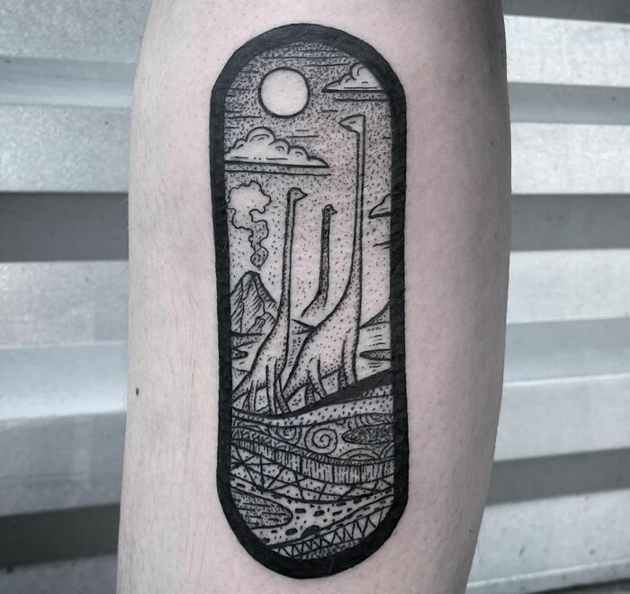 Dinosaur tattoo on arm with brachiosaurus silhouettes and landscape design.