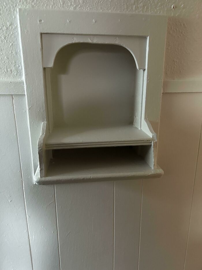 Built-in wall niche with shelf painted white, an example of people stumbling upon mysterious objects in homes.