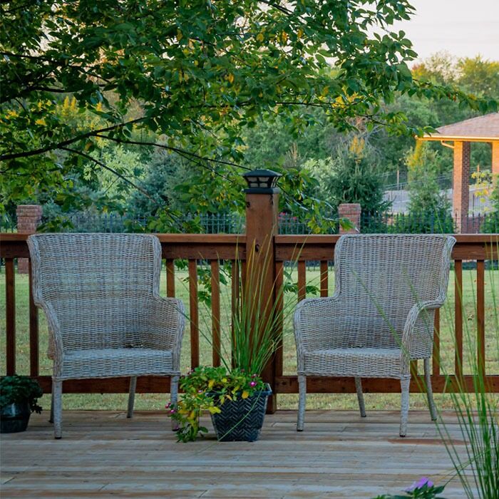 Porch without roof and with wicker furniture