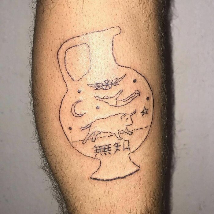 Failed tattoo depicting a vase with abstract drawings, including a bull and stars, on a person's arm.