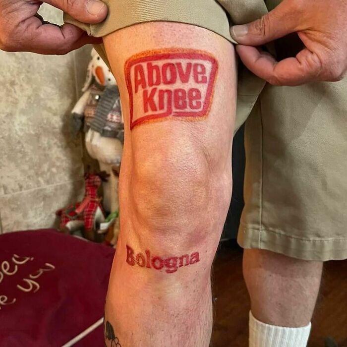Failed tattoo of a sandwich logo above a knee with the word "Bologna" below.
