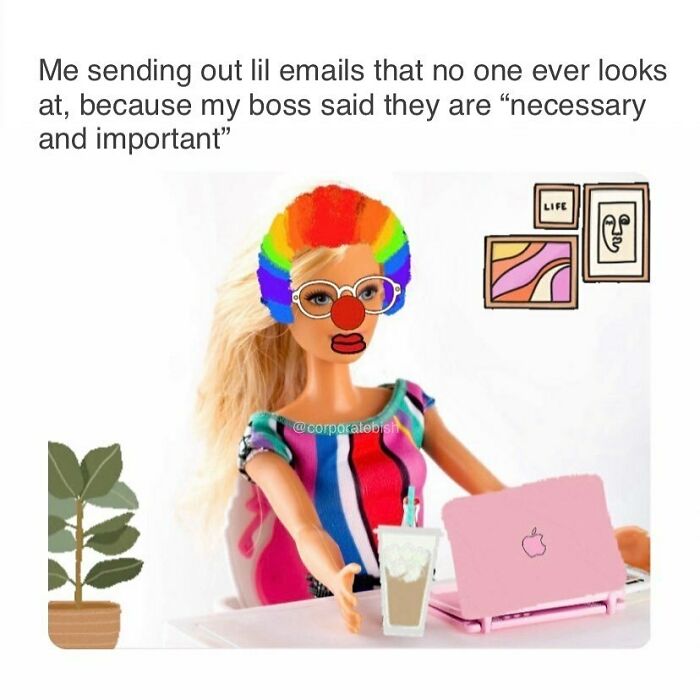 Clown-themed doll at desk with laptop, symbolizing funny work memes about unnecessary emails.