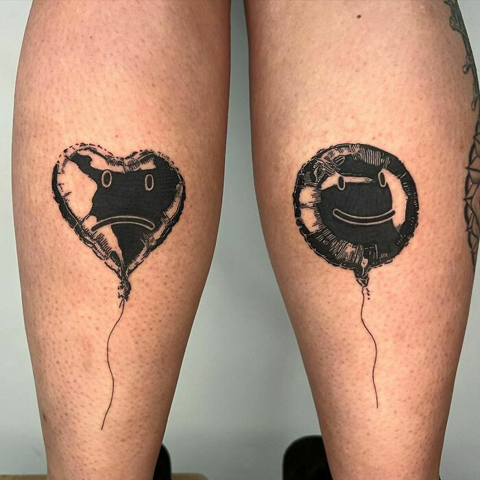 Two clever tattoos by a creative artist: a heart-shaped sad balloon and a circular happy balloon, both with hidden meanings.