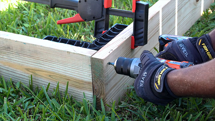 Photo where two boards are being connected to form an angle.