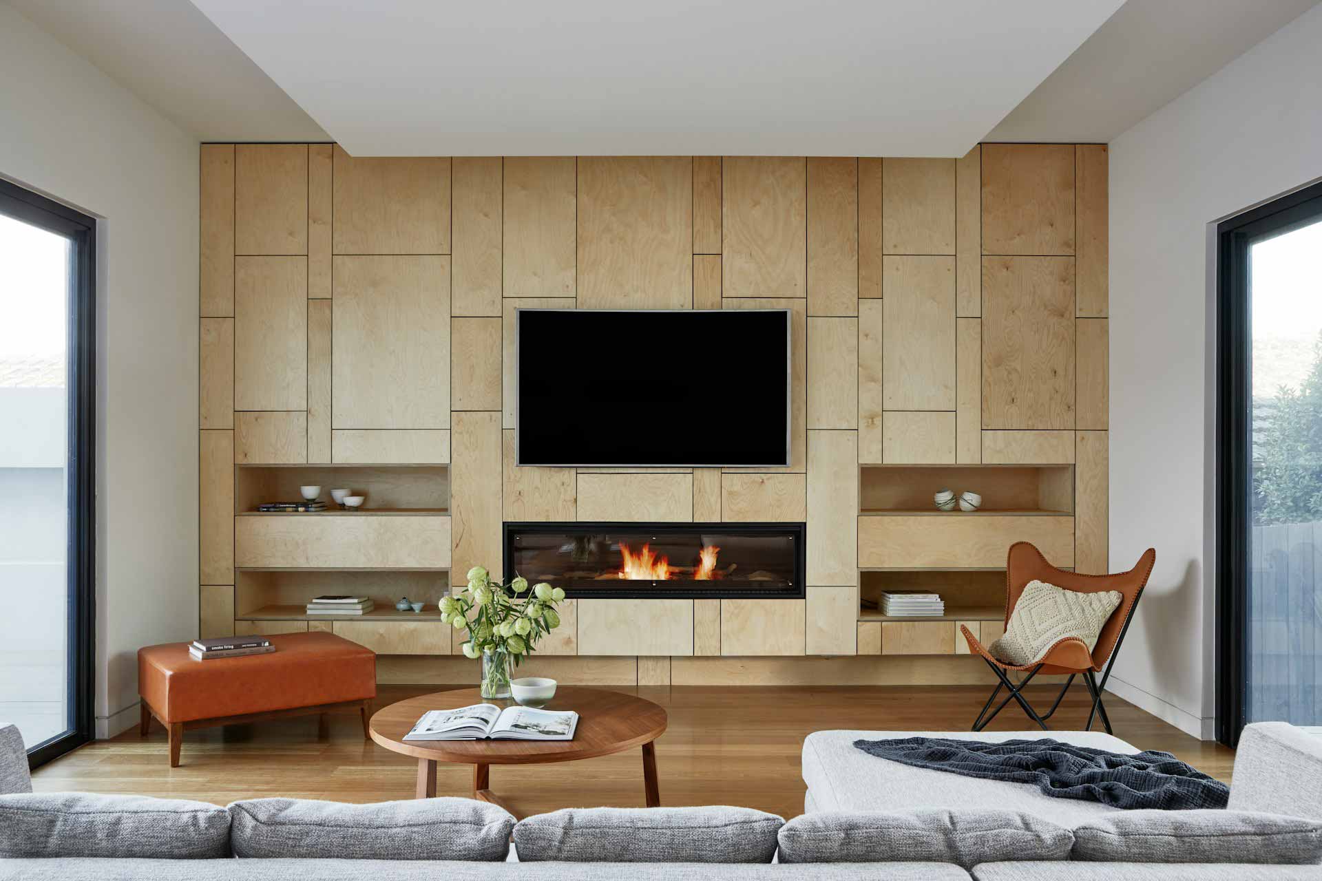 Spacious living room with wood panels wall and flat-screen TV Spacious living room with wood panels wall and flat-screen TV