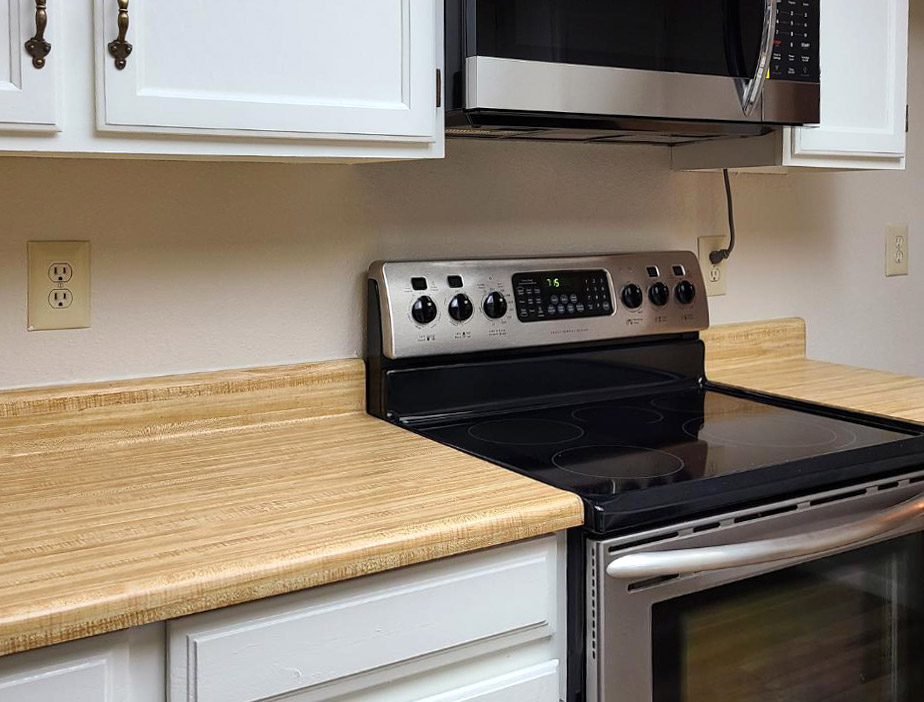 Kitchen with light wood laminate countertop