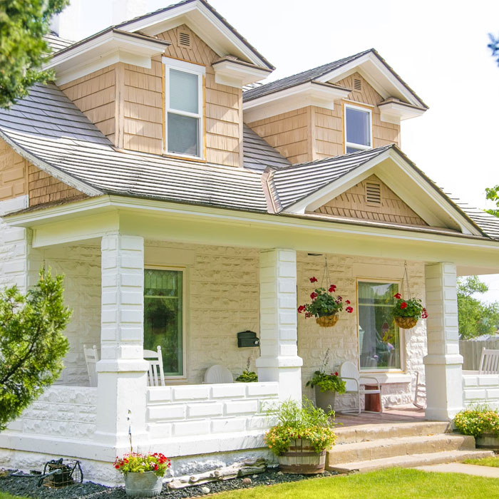 House with porch and hanging plants