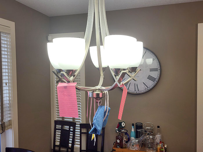 My Wife's Solution To Stop Me From Hitting My Head On This Light Fixture After We Moved The Dinner Table