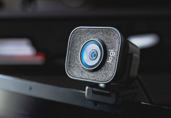 Webcam on a desk setup, highlighting modern tech used by vet techs for consultations about feline hydration.