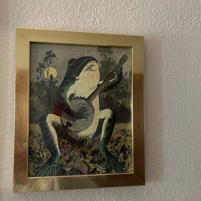 Bring The Folksy Charm Of A Banjo-Strumming Frog Into Your Home Because If You're Going To Have A Wall Animal, Make It One That Plays A Mean String!