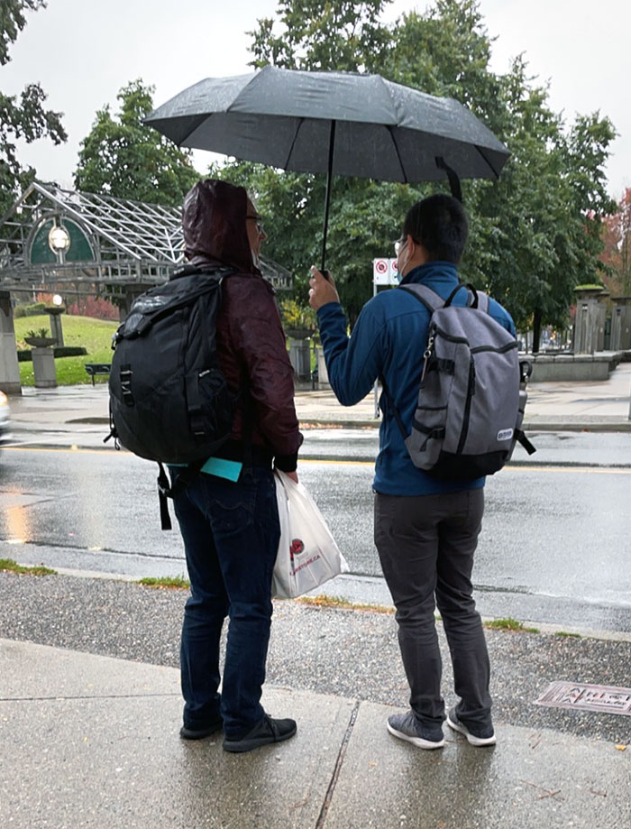 Today, A Guy On The Right Offered To Share His Umbrella With The Guy On The Left, A Stranger, While They Were Waiting For The Bus In The Rain