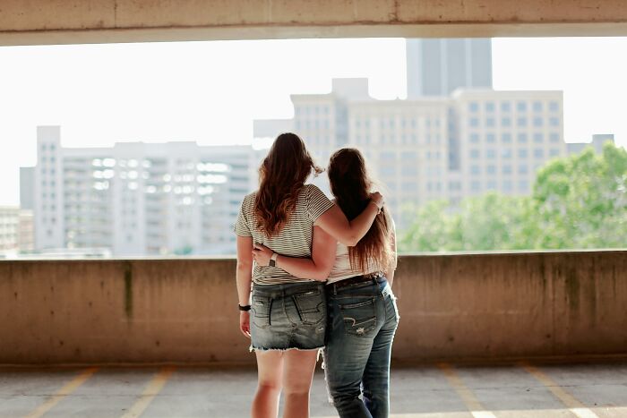 Two Women Standing Inside Parking Lot