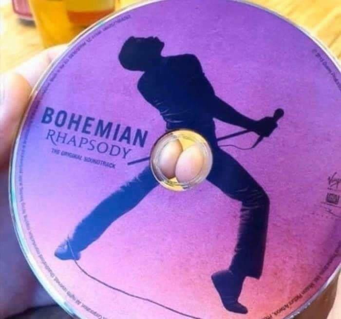 CD of Bohemian Rhapsody with a humorous visual effect, featuring a b**t shape through the center hole.