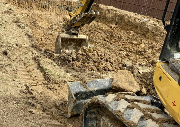 Person digging a hole size of a pool
