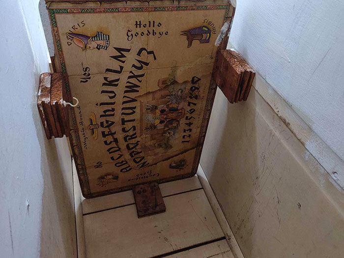 This Shelf In The Closet Of Our New Home Was An Upside-Down, Wooden Ouija Board
