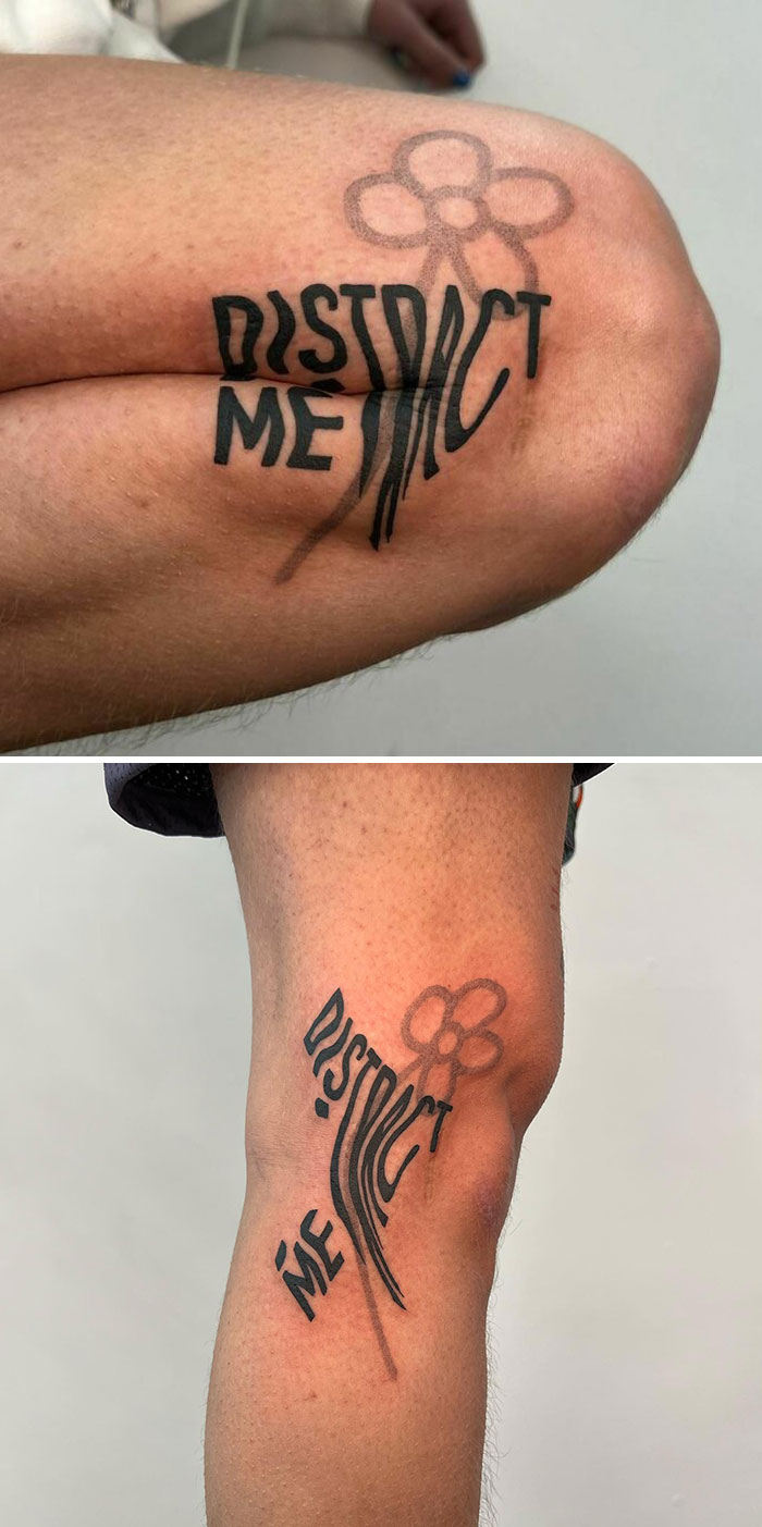 Creative artist's tattoo features "Distract Me" text and a subtle flower design on a person's arm.