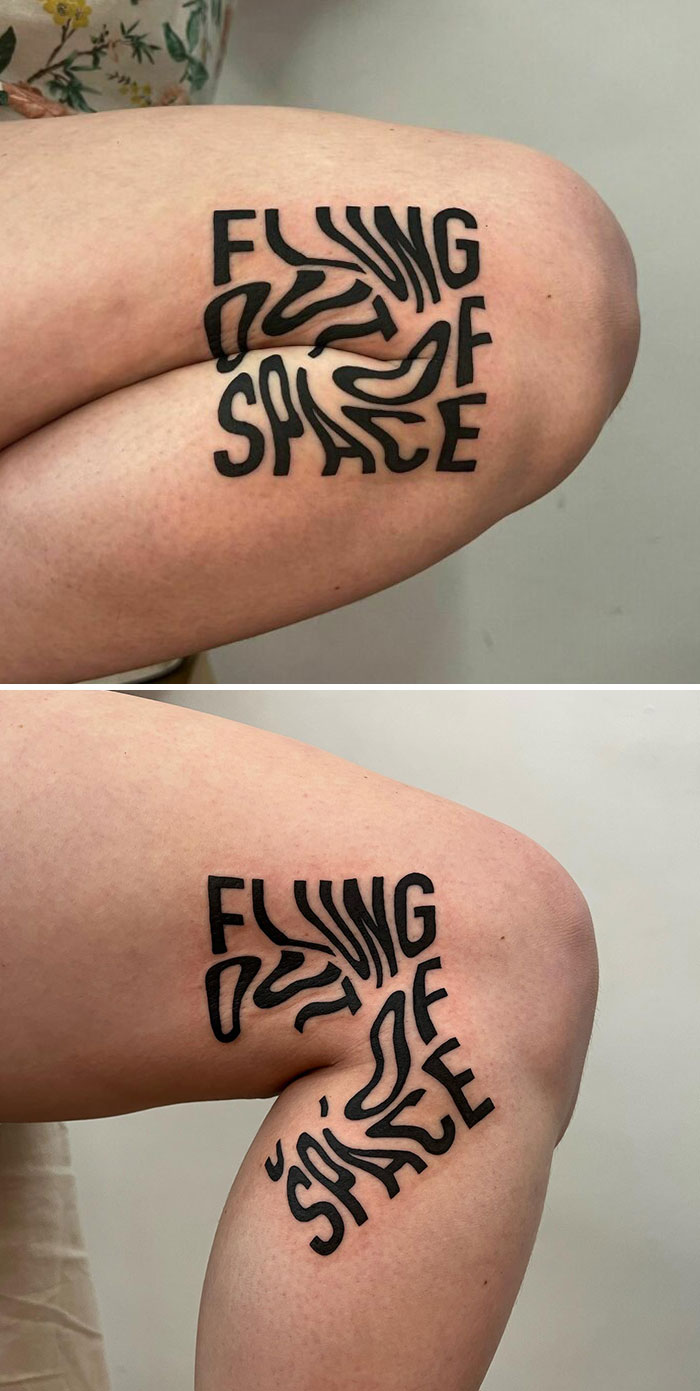 Clever tattoo with text "FLYING OUT OF SPACE" creatively distorted over the knee.