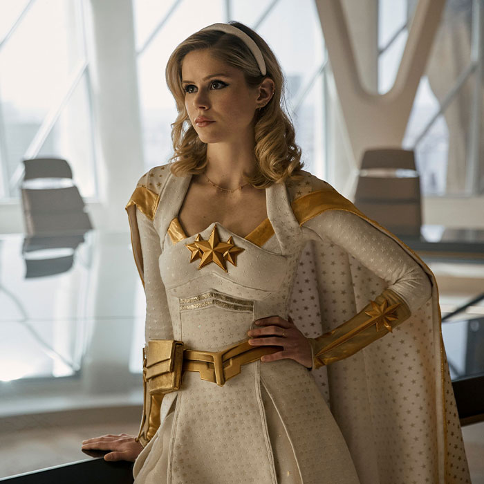 Young woman dressed as a superhero, representing famous people accused of plastic surgery and how they responded.