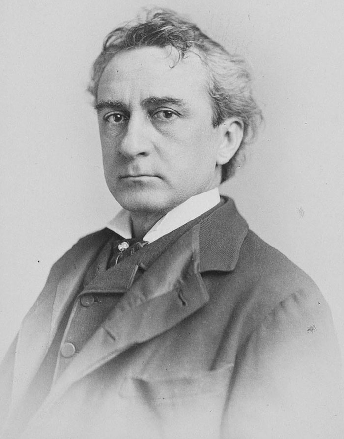 Black and white portrait of a serious man in a suit, illustrating 150 weird and fun facts to know from an online thread.