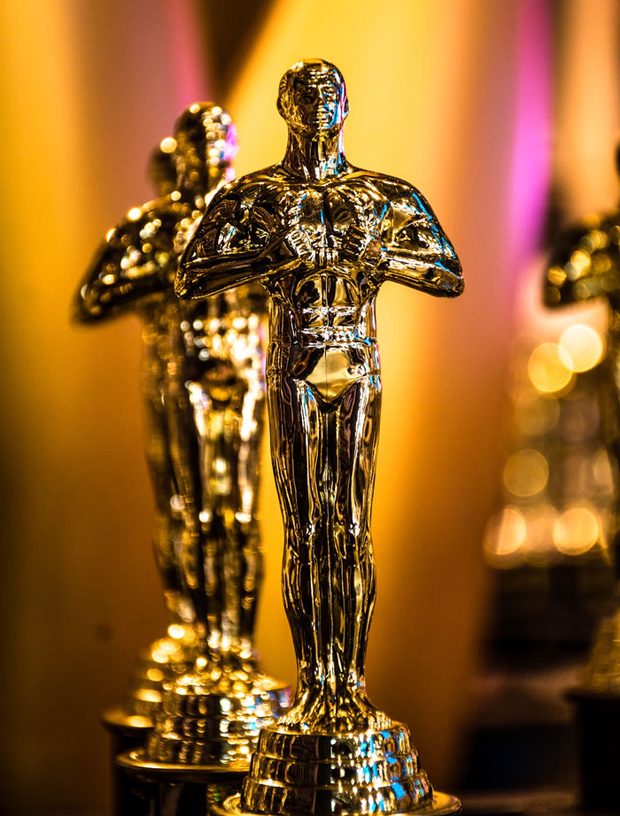 Shiny gold statues lined up with reflective surfaces, representing weird fun facts shared in an online thread.