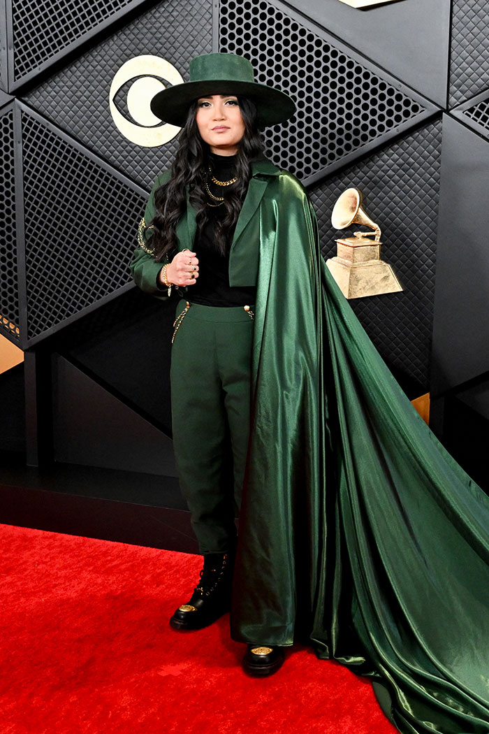 Alex Ritchie Stunned In A Green Suit And Long Flowing Cape