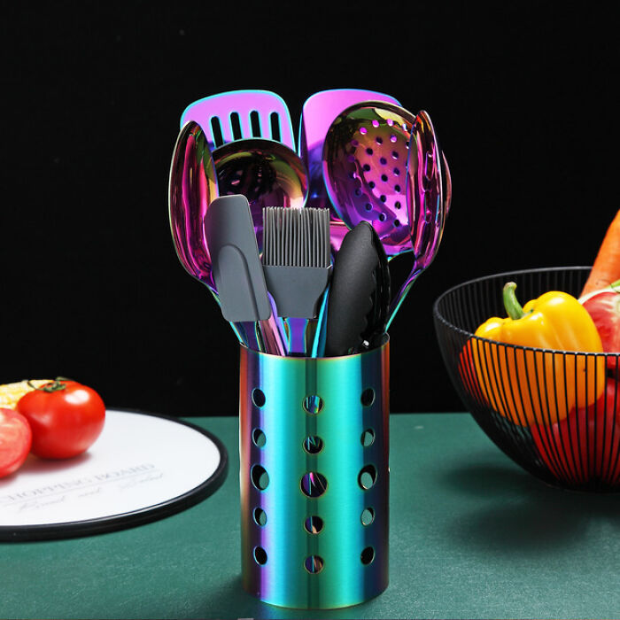 Iridescent kitchen utensils in a rainbow metal holder on counter with tomatoes and peppers, kitchen feel like new